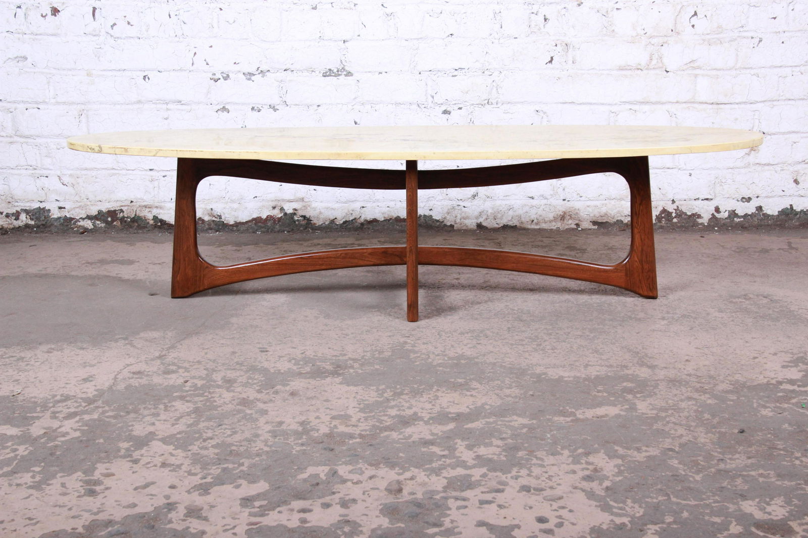 Authentic Adrian Pearsall for Craft Associates Sculpted: A gorgeous mid-century modern surfboard coffee or cocktail table By Adrian Pearsall for Craft Associates USA 1960s Sculpted walnut base + marble top Measures: 64.13"W x 21.75"D x 15.5"H. Very good con