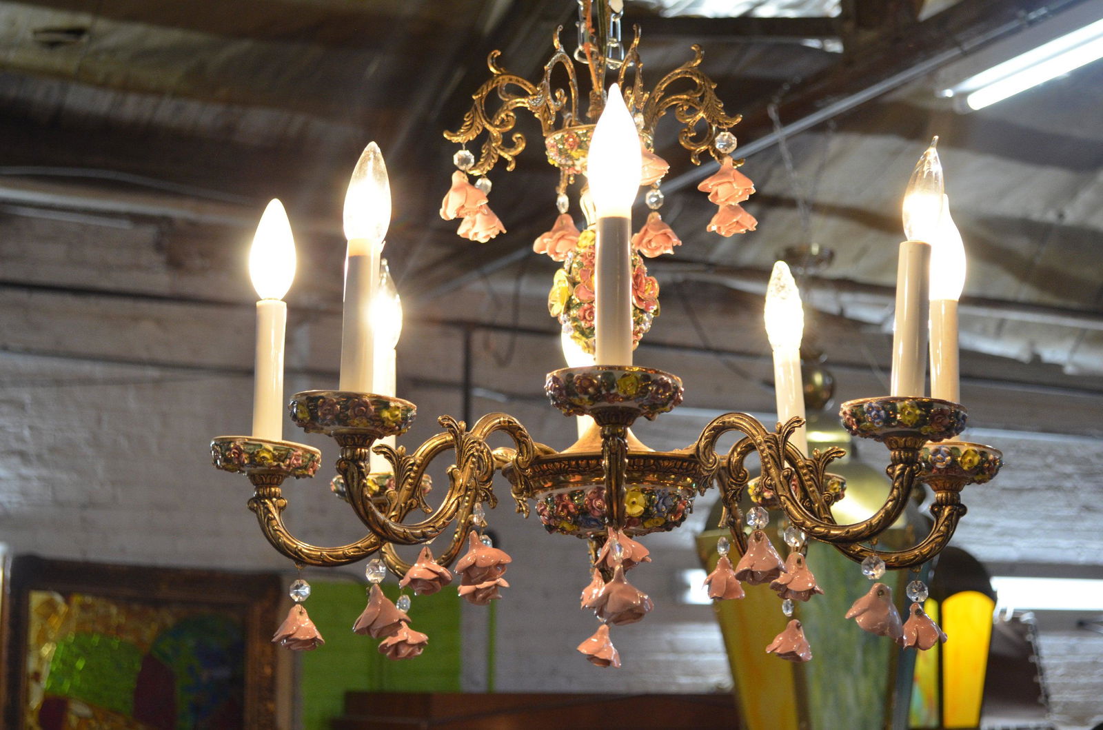 Shabby Chic Capodimonte 8 Arm Chandelier with: Italian Capodimonte 8 Arm Chandelier with Multicolor Porcelain Flowers Missing one rosette. Circa 1930 H 18 D 22 Good condition All Bidhaus items come with a 100% money-back guarantee that the item is