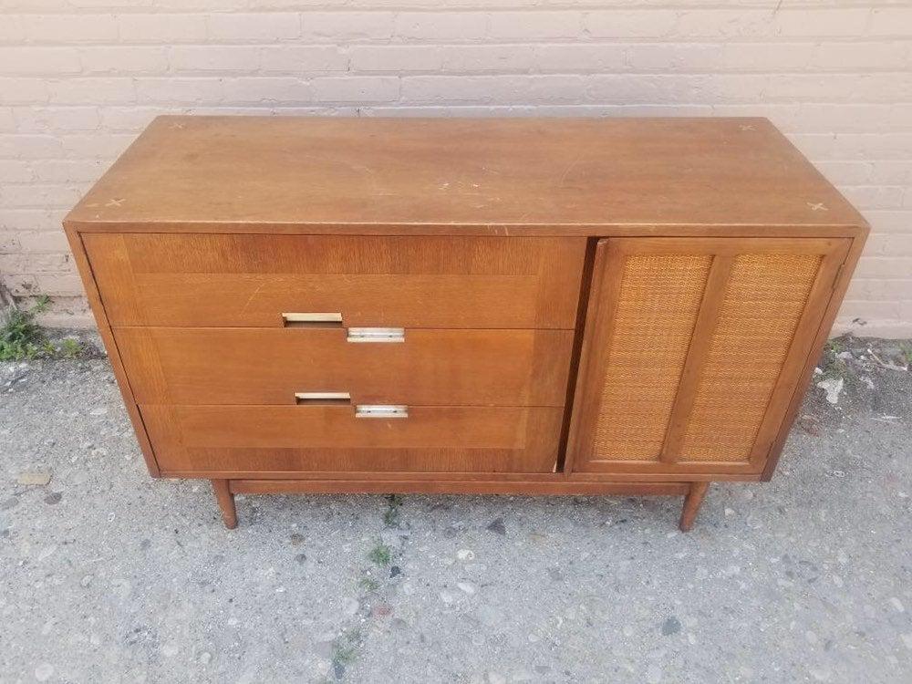 Mid Century Modern American of Martinsville Inlaid: Mid Century Modern American of Martinsville Inlaid Nickel Star Credenza This vintage Mid Century walnut credenza features three smooth sliding drawers on the left a two paneled caned fronted cabinet o
