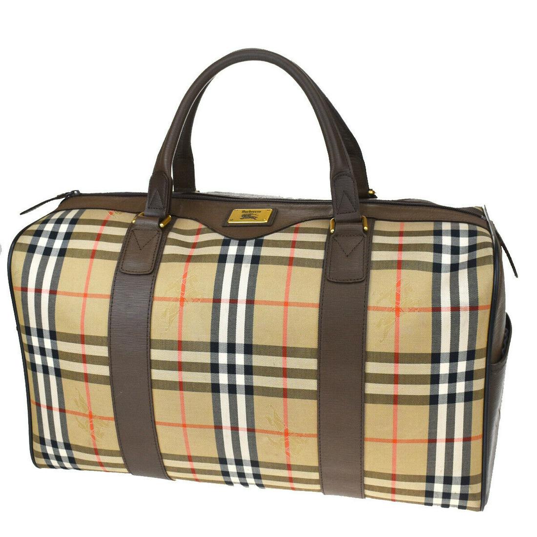 Authentic BURBERRY Hand Bag: Brand: BURBERRY Model: Hand Bag Country of Origin: Material: Canvas Leather Color: Brown Beige Size (Inch): W18.1X H10.2X D8.7"Size (CM): W46X H26X D22Cm All Bidhaus items come with a 100 % money-back