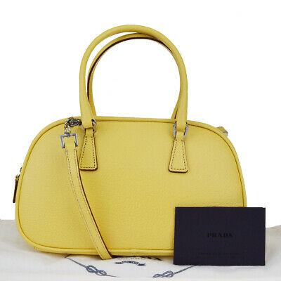 Authentic PRADA Shoulder Hand Bag: Brand: PRADA Model: Shoulder Hand Bag Country of Origin: Material: Leather Color: Yellow Size (Inch): W8.7X H5.5X D3.9"Size (CM): W22X H14X D10Cm All Bidhaus items come with a 100 % money-back authent