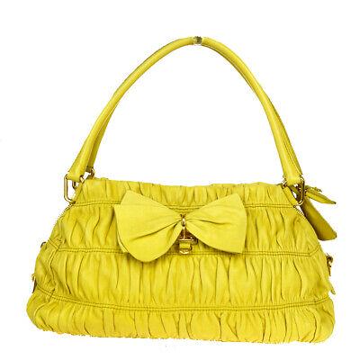 Authentic PRADA Shoulder Bag: Brand: PRADA Model: Shoulder Bag Country of Origin: Material: Leather Color: Yellow Size (Inch): W12.6X H7.9X D5.5"Size (CM): W32X H20X D14Cm All Bidhaus items come with a 100 % money-back authenticit