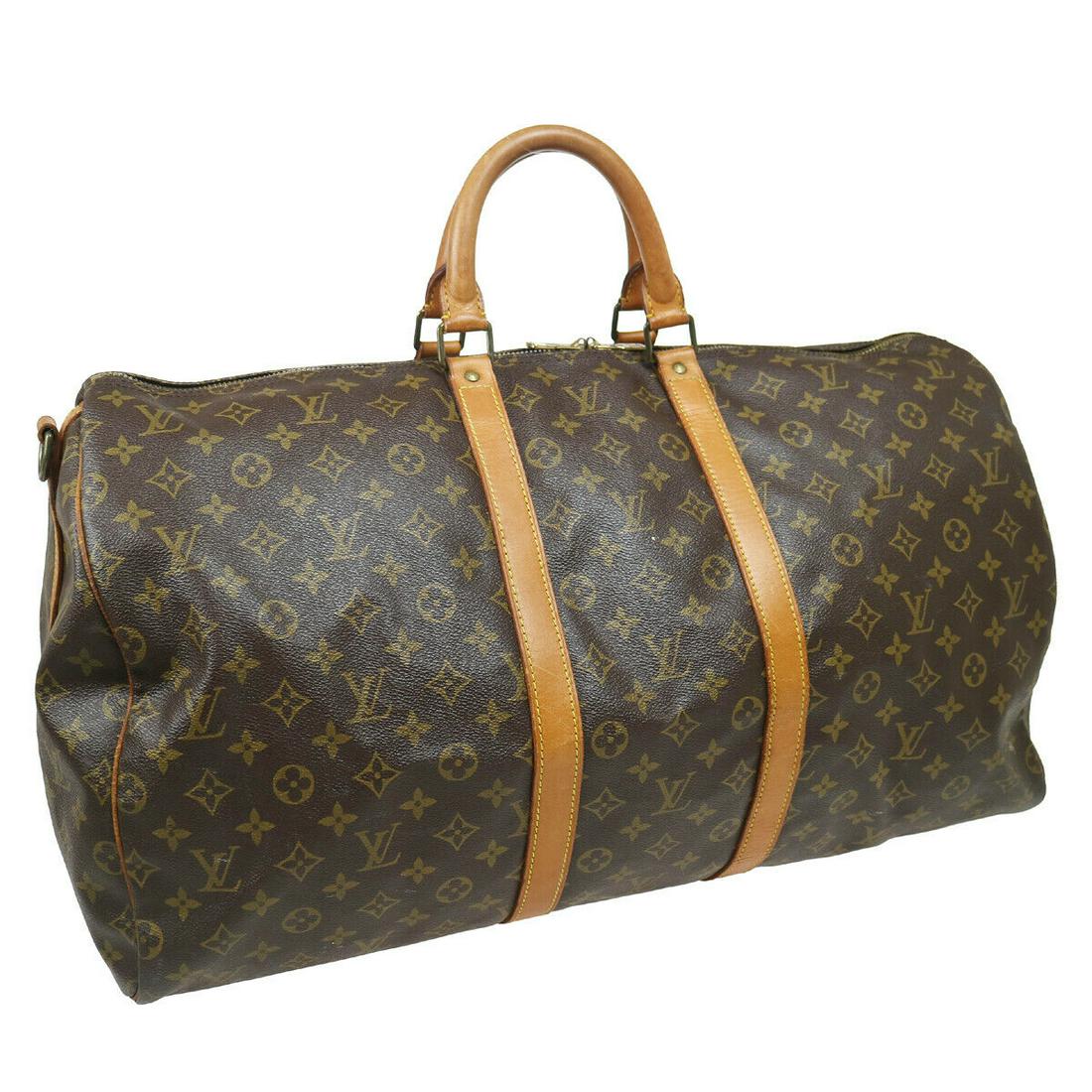 Authentic LOUIS VUITTON Monogram Travel Hand Bag: Brand: LOUIS VUITTON Model: Monogram Travel Hand Bag Country of Origin: France Material: Canvas Color: Brown Size (Inch): W 22.0 x H 11.8 x D 9.8 " Handle Drop. 4.3 " Strap Drop. 17.3 - 20.9 " Size (C