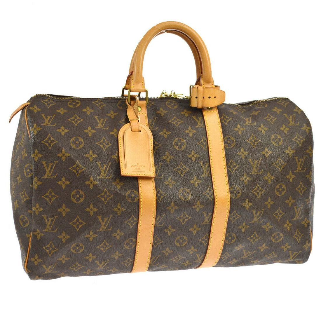 Authentic LOUIS VUITTON Monogram Travel Hand Bag: Brand: LOUIS VUITTON Model: Monogram Travel Hand Bag Country of Origin: France Material: Canvas Color: Brown Size (Inch): W 17.7 x H 10.0 x D 7.9 " Handle Drop. 4.3 " Size (CM): W 45.0 x H 25.5 x D 20