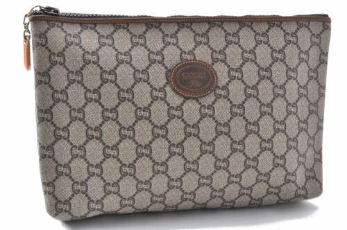 Authentic GUCCI Pouch: Brand: GUCCI Model: Pouch Country of Origin: Italy Material: PVC Color: Brown Bag Length: 11inches(28cm) Bag Height: 7.1inches(18cm) Bag Depth: 2.8inches(7cm) All Bidhaus items come with a 100 % money