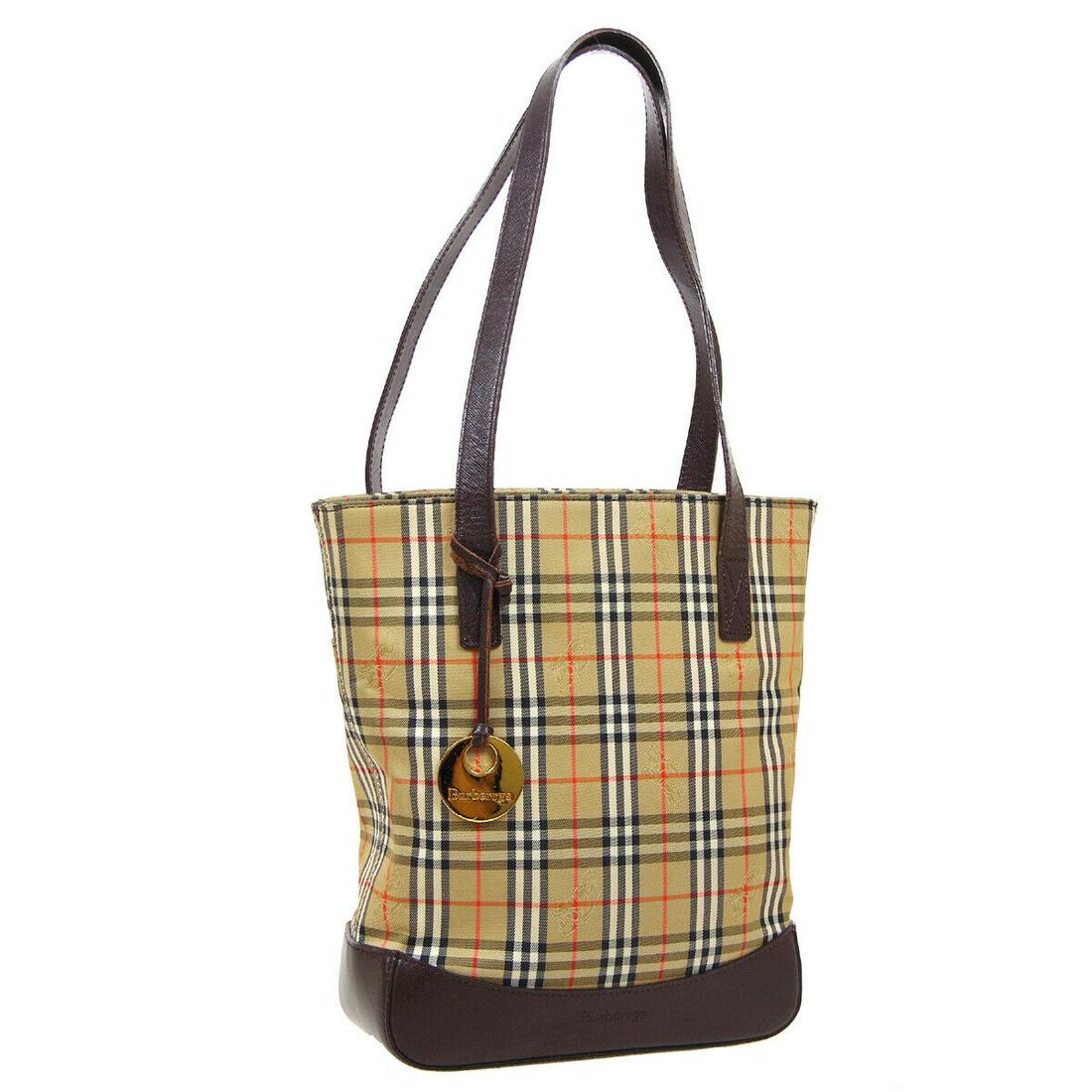 Authentic BURBERRY Hand Tote Double Handles: Brand: BURBERRY Model: Hand Tote Double Handles Country of Origin: Unknown Material: Fabric Color: Beige Brown Size (Inch): W 8.9 x H 11.0 x D 3.7 " Strap Drop. 10.2 " Size (CM): W 22.5 x H 28.0 x D 9