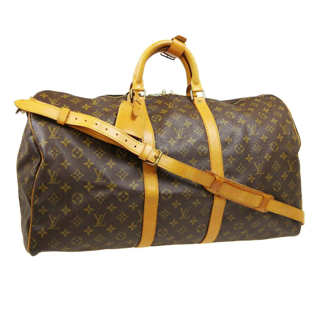 Authentic LOUIS VUITTON Keepall Bandouliere 55 Double: Brand: LOUIS VUITTON Model: Keepall Bandouliere 55 Double Handles Country of Origin: France Material: Canvas Color: Brown Size (Inch): W 22.0 x H 11.8 x D 9.8 " Handle Drop. 4.3 " Strap Drop. 18.5 - 2