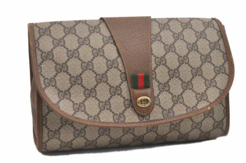 Authentic GUCCI Clutch Bag: Brand: GUCCI Model: Clutch Bag Country of Origin: Italy Material: PVC Color: Brown Bag Length: 9.8inches(25cm) Bag Height: 6.3inches(16cm) Bag Depth: 2.2inches(5.5cm) All Bidhaus items come with a 100