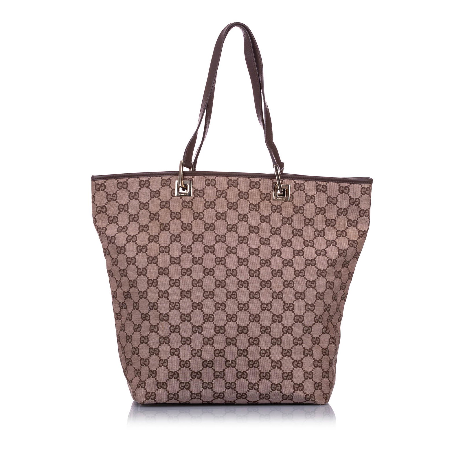 Authentic Gucci GG Canvas Tote Bag: This tote bag features a canvas body with leather trim flat leather straps an open top and an interior zip pocket. Brand: Gucci Model: GG Canvas Tote Bag Origin: ITALY Category: Tote Bag Color: Brown 