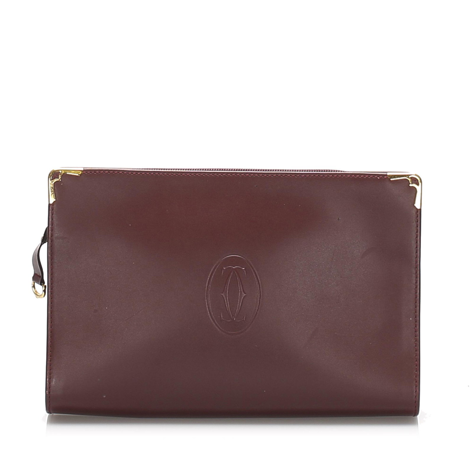 Authentic Cartier Must De Cartier Leather Clutch Bag: This clutch bag features a leather body an exterior back slip pocket a top zip closure and an interior zip pocket. Brand: Cartier Model: Must De Cartier Leather Clutch Bag Origin: France Category: Clu