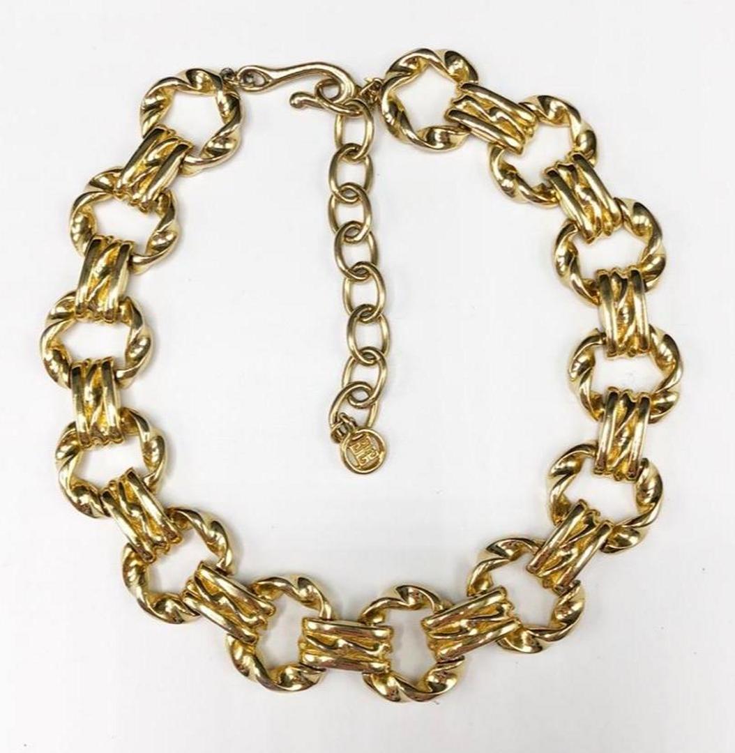 Authentic Givenchy Engraved Chain Necklace: Brand: Givenchy Material: Gold-plated Style: Chain Dimensions(inch): 14 L x 1 W ( 4” extension) Detail: Hallmark: Givenchy Logo Country of Origin: France All Bidhaus items come with a 100% money