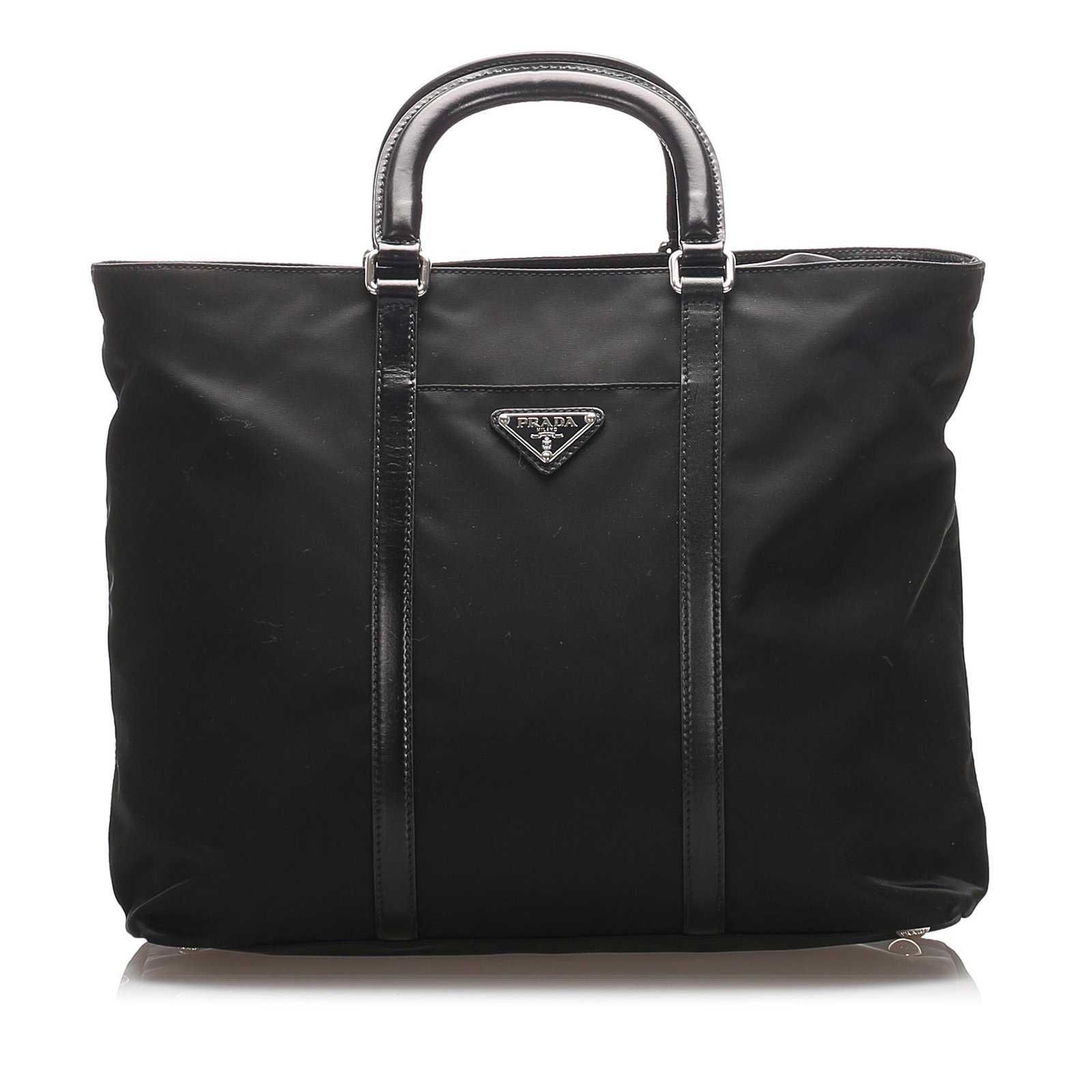 Authentic Prada Tessuto Tote Bag: This tote features a nylon body with leather trim, a front exterior slip pocket, flat leather handles, a top zip closure, and an interior zip pocket. Brand: Prada Model: Tessuto Tote Bag Origin: Italy