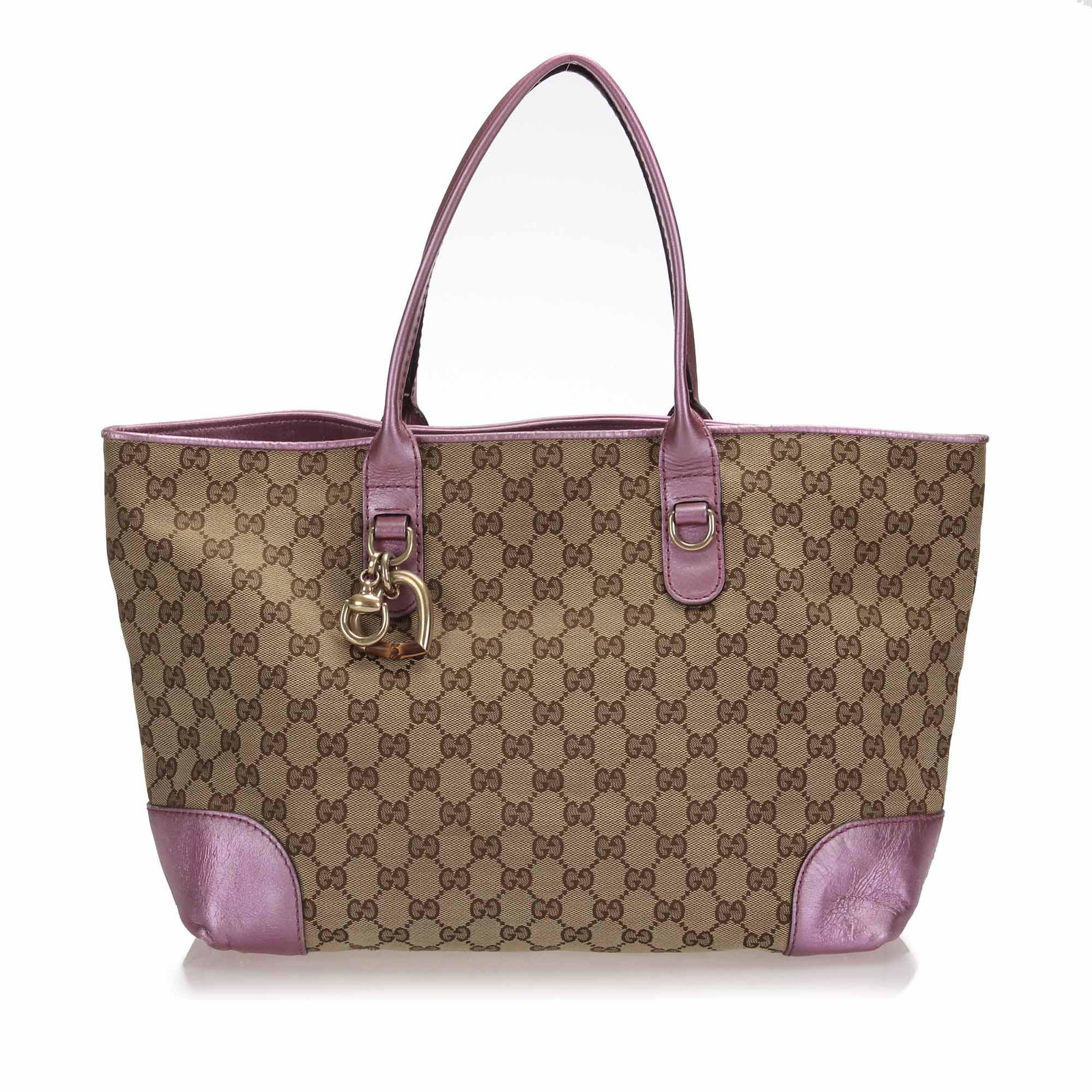 Authentic Gucci GG Canvas Heart Bit Tote Bag: The Heart Bit tote bag features a canvas body with leather trim a metal charm flat shoulder straps an open top and interior zip and slip pockets. Brand: Gucci Model: GG Canvas Heart Bit Tote Bag Origi