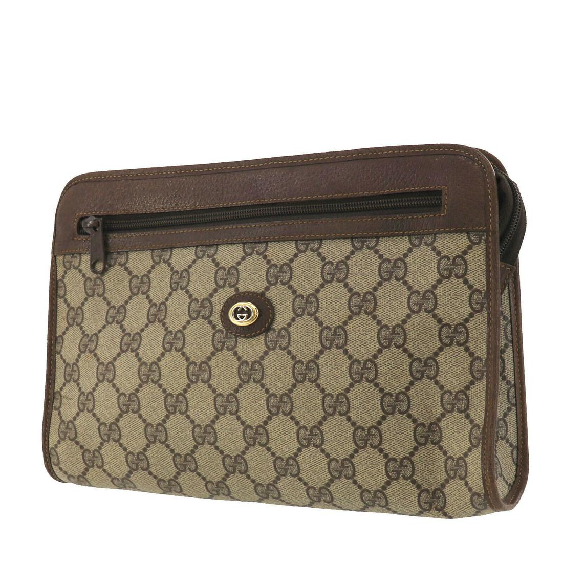 Authentic GUCCI Pouch: Brand: GUCCI Model: Pouch Country of Origin: Italy Material: Leather Color: Gold Bag Length: 10.6 Bag Height: 7.0 Bag Depth: 2.3 All Bidhaus items come with a 100 % money-back authenticity guarantee. 