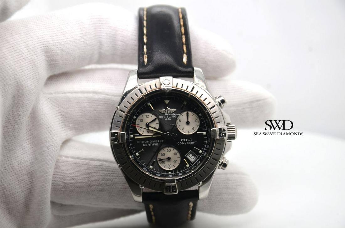 Authentic Breitling Colt Chronograph: Basic Info Listing number: 9OF614 Brand: Breitling Model: Colt Chronograph Reference number: A73350 Movement: Quartz Case material: Steel Bracelet material: Leather Year of production 2005 Condition V