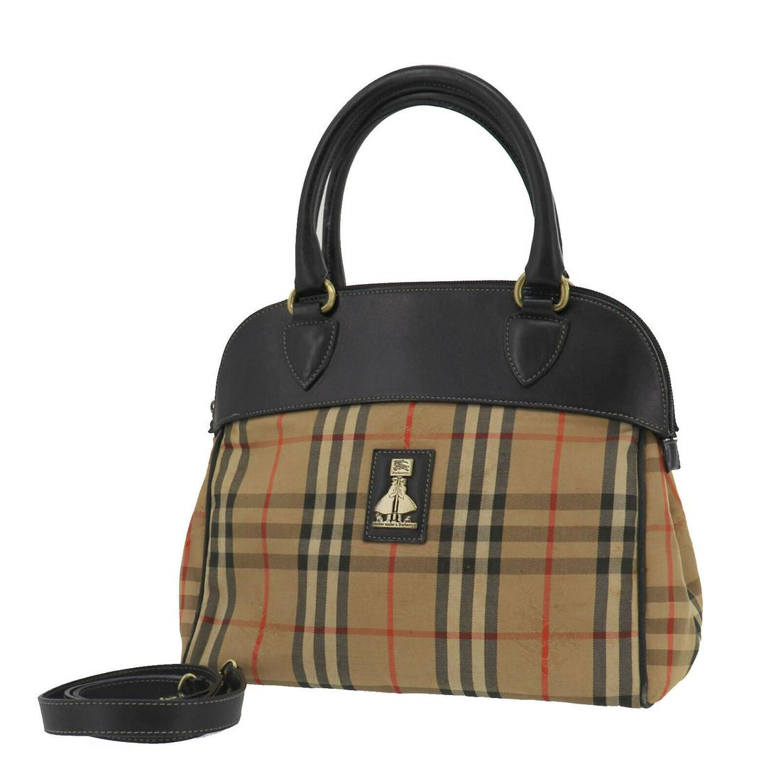 Authentic BURBERRY Hand Bag: Brand: BURBERRY Model: Hand Bag Country of Origin: Material: Canvas Color: Black Size (inch): medium All Bidhaus items come with a 100 % money-back authenticity guarantee. ALL SALES ARE FINAL. Please