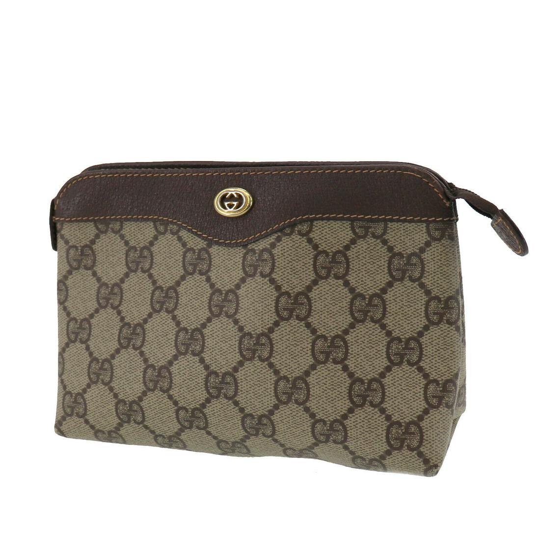 Authentic GUCCI Pouch: Brand: GUCCI Model: Pouch Country of Origin: Italy Material: Canvas Color: Brown Bag Length: 7.2 Bag Height: 5.1 Bag Depth: 2.5 All Bidhaus items come with a 100 % money-back authenticity guarantee. A