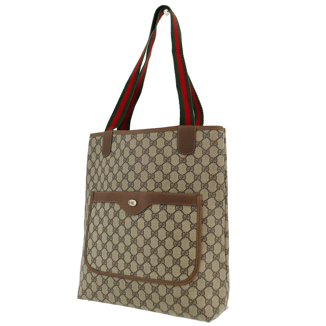 Authentic GUCCI Tote: Brand: GUCCI Model: Tote Country of Origin: Italy Material: Canvas Color: Gold Bag Length: 12.2 Bag Height: 14.5 Bag Depth: 3.5 All Bidhaus items come with a 100 % money-back authenticity guarantee. A