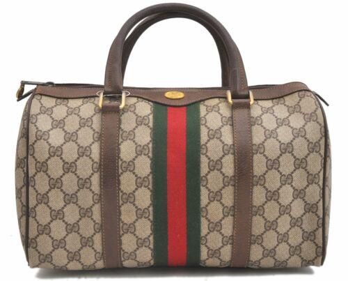 Authentic GUCCI Hand Bag: Brand: GUCCI Model: Hand Bag Country of Origin: Italy Material: PVC Color: Brown Bag Length: 12.6inches (32cm) Bag Height: 7.1inches (18cm) Bag Depth: 5.5inches (14cm) All Bidhaus items come with a 10