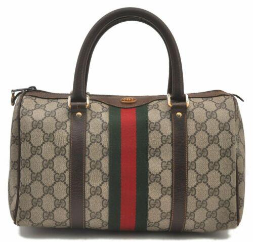 Authentic GUCCI Hand Bag: Brand: GUCCI Model: Hand Bag Country of Origin: Italy Material: PVC Color: Brown Bag Length: 11.4inches (29cm) Bag Height: 6.9inches (17.5cm) Bag Depth: 4.9inches (12.5cm) All Bidhaus items come with 