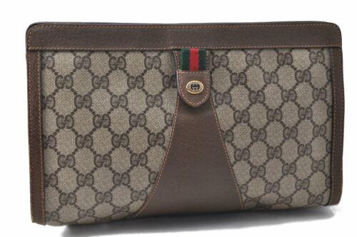 Authentic GUCCI Clutch Bag: Brand: GUCCI Model: Clutch Bag Country of Origin: Italy Material: PVC Color: Brown Bag Length: 10.8inches(27.5cm) Bag Height: 6.7inches(17cm) Bag Depth: 2.8inches(7cm) All Bidhaus items come with a 10