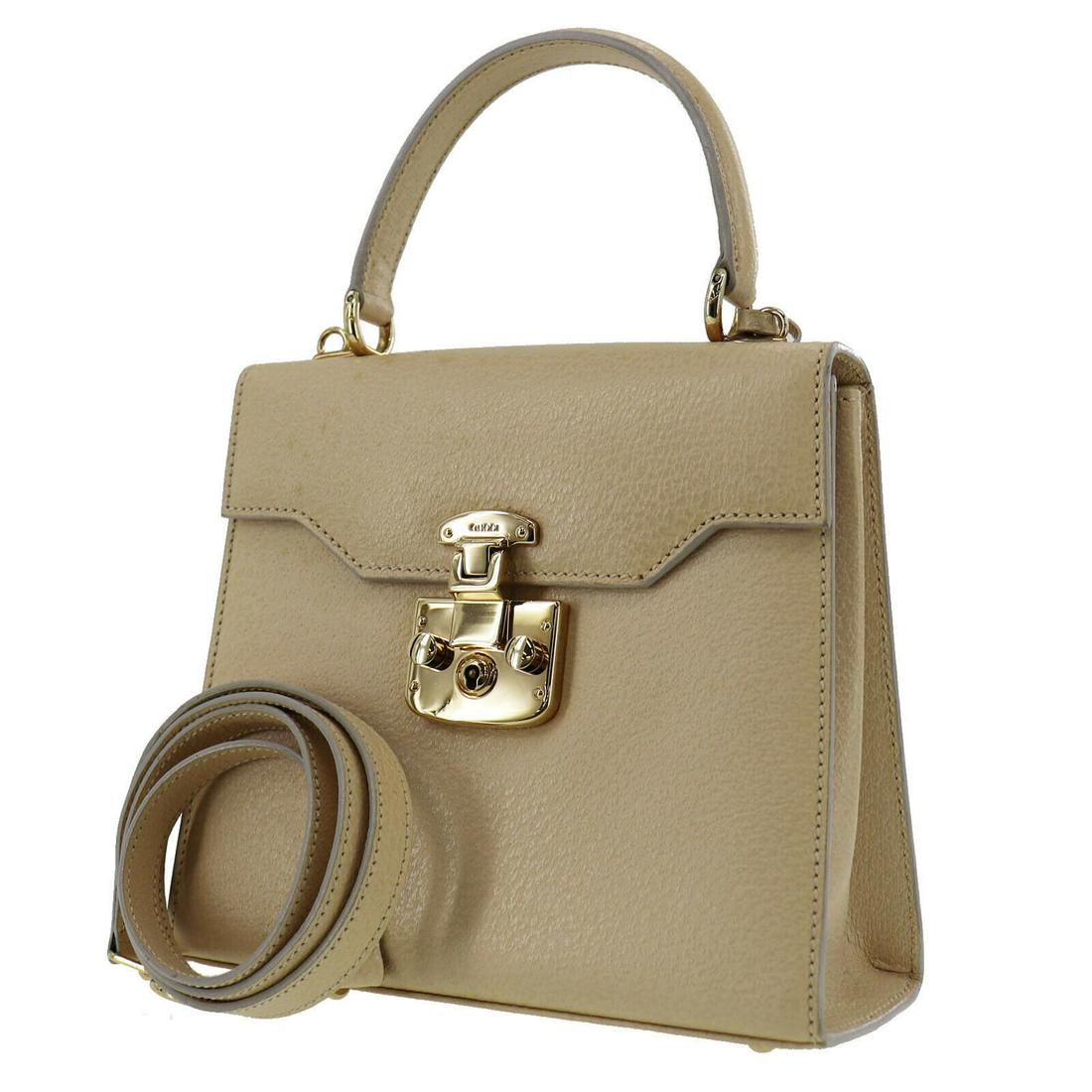 Authentic GUCCI Shoulder Hand Bag: Brand: GUCCI Model: Shoulder Hand Bag Country of Origin: Italy Material: Leather Color: Gold Bag Length: 7.8 Bag Height: 6.8 Bag Depth: 3.1 All Bidhaus items come with a 100 % money-back authenticity 