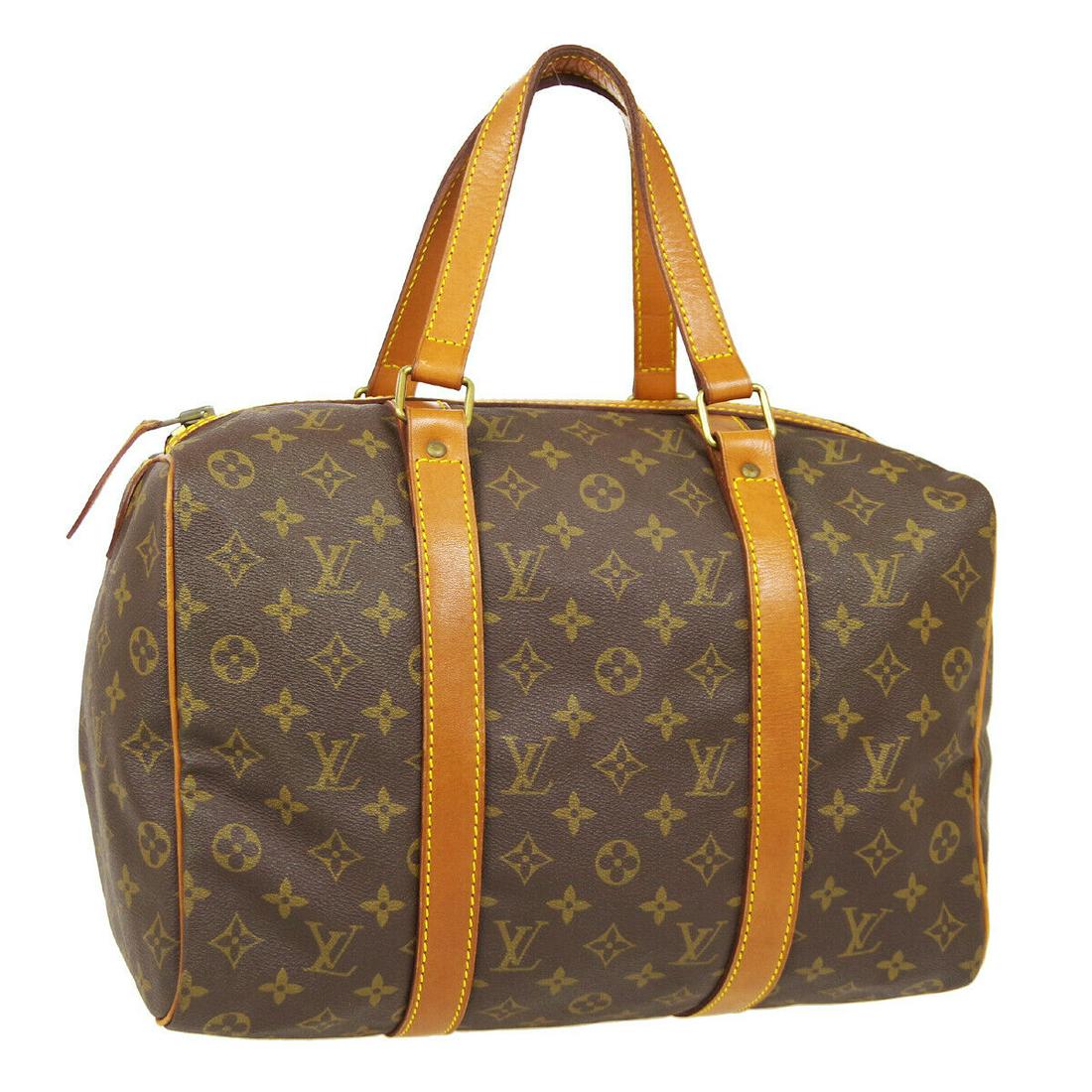 Authentic LOUIS VUITTON Sac Souple 35 Double Handles: Brand: LOUIS VUITTON Model: Sac Souple 35 Double Handles Country of Origin: France Material: Canvas Color: Brown Size (Inch): W 13.8 x H 9.1 x D 7.1 " Handle Drop. 7.1 " Size (CM): W 35.0 x H 23.0 x D