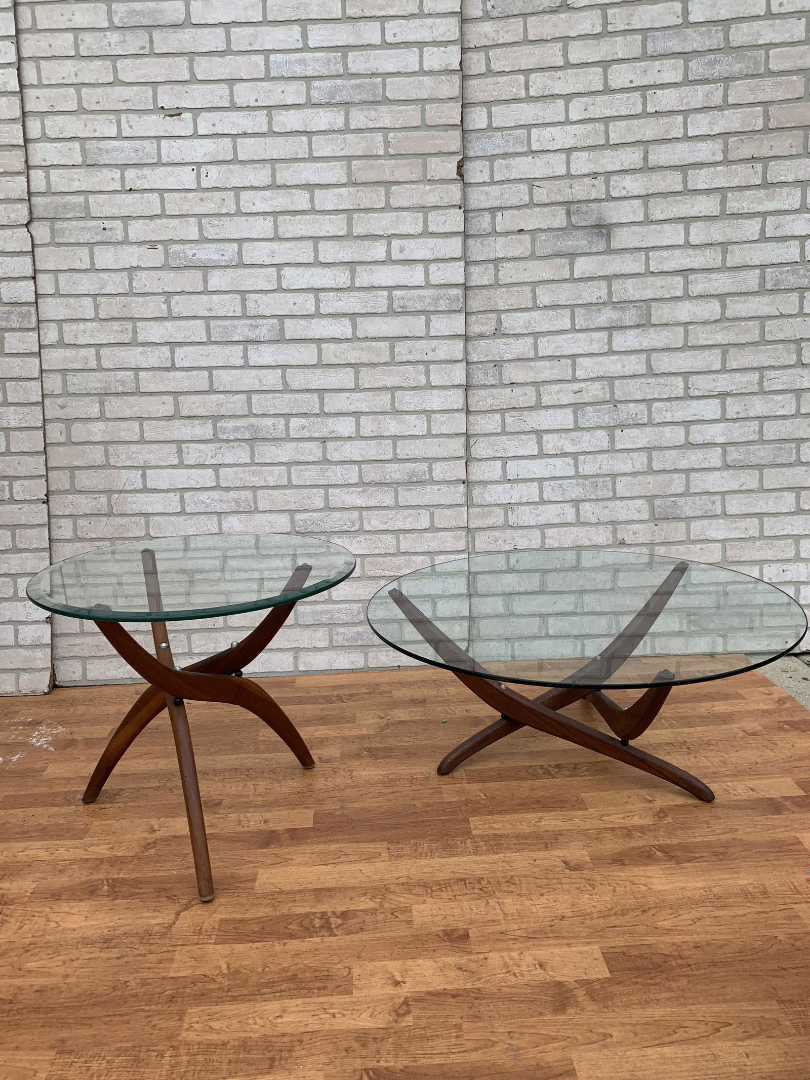Mid Century Modern Forest Wilson Sculptural Round: Mid Century Modern Forest Wilson Sculptural Round Coffee and 2 Side Tables - 3 Piece Set A Minimalist and striking design by Forest Wilson It features a solid walnut three leg base and a glass top. We