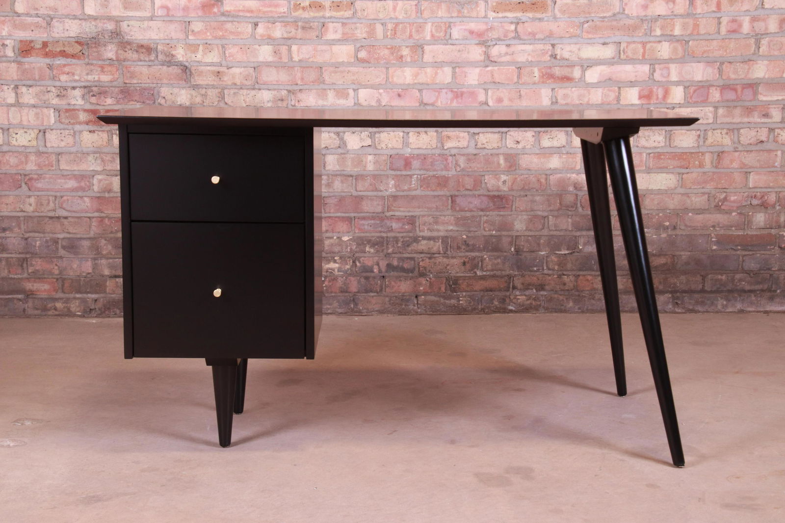 Paul McCobb Planner Group Mid-Century Modern Writing: An exceptional minimalist mid-century modern writing desk By Paul McCobb for Winchendon Furniture "Planner Group" USA 1950s Black lacquered solid maple with original brass hardware. Measures: 48"W x 2