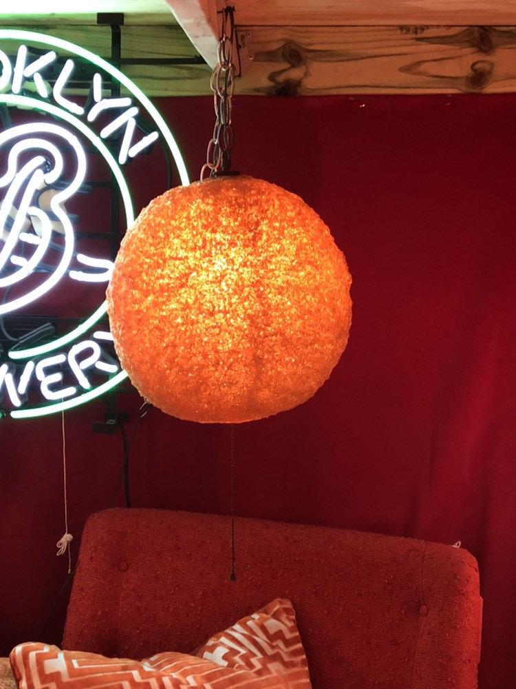 Mid Century Modern Orange Spaghetti Hanging Swag Lucite: Vintage Mid Century Modern Orange Spaghetti Hanging Swag Lucite Lamp Circa 1970 H 12” D 12” Good condition All Bidhaus items come with a 100% money-back guarantee that the item is as descr