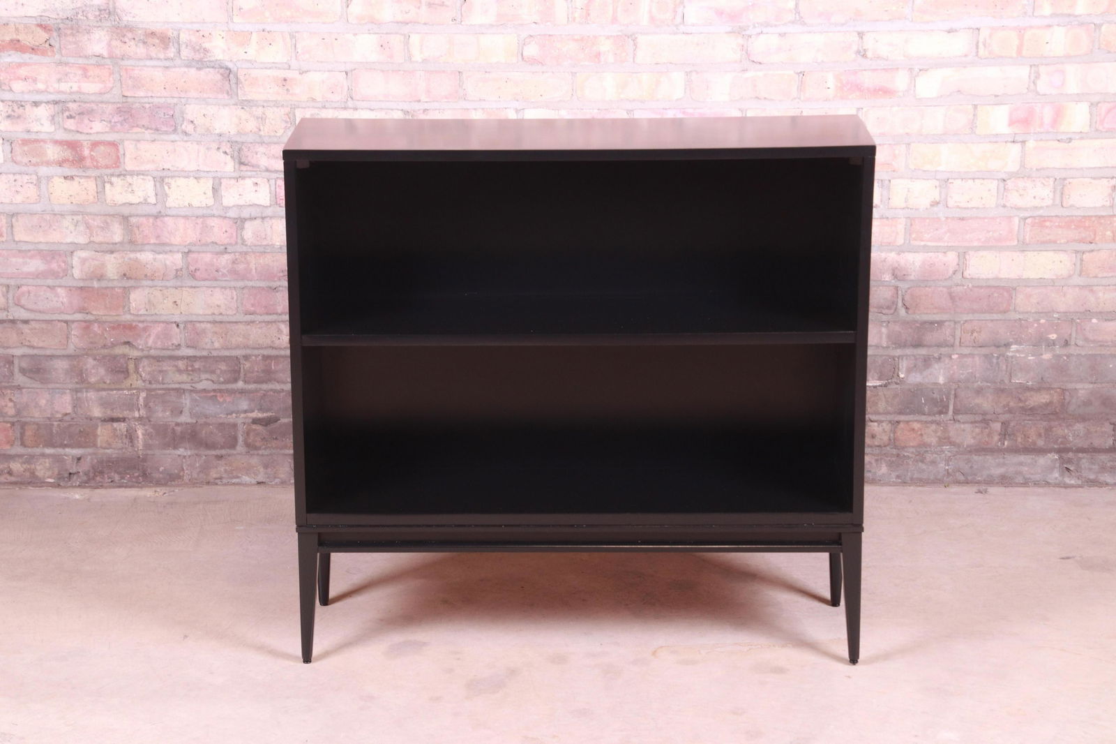 Paul McCobb Planner Group Mid-Century Modern Black: An exceptional mid-century modern black lacquered solid birch bookcase By Paul McCobb for Winchendon Furniture "Planner Group" USA 1950s Measures: 36"W x 12.13"D x 33.5"H. Newly refinished. Excellent