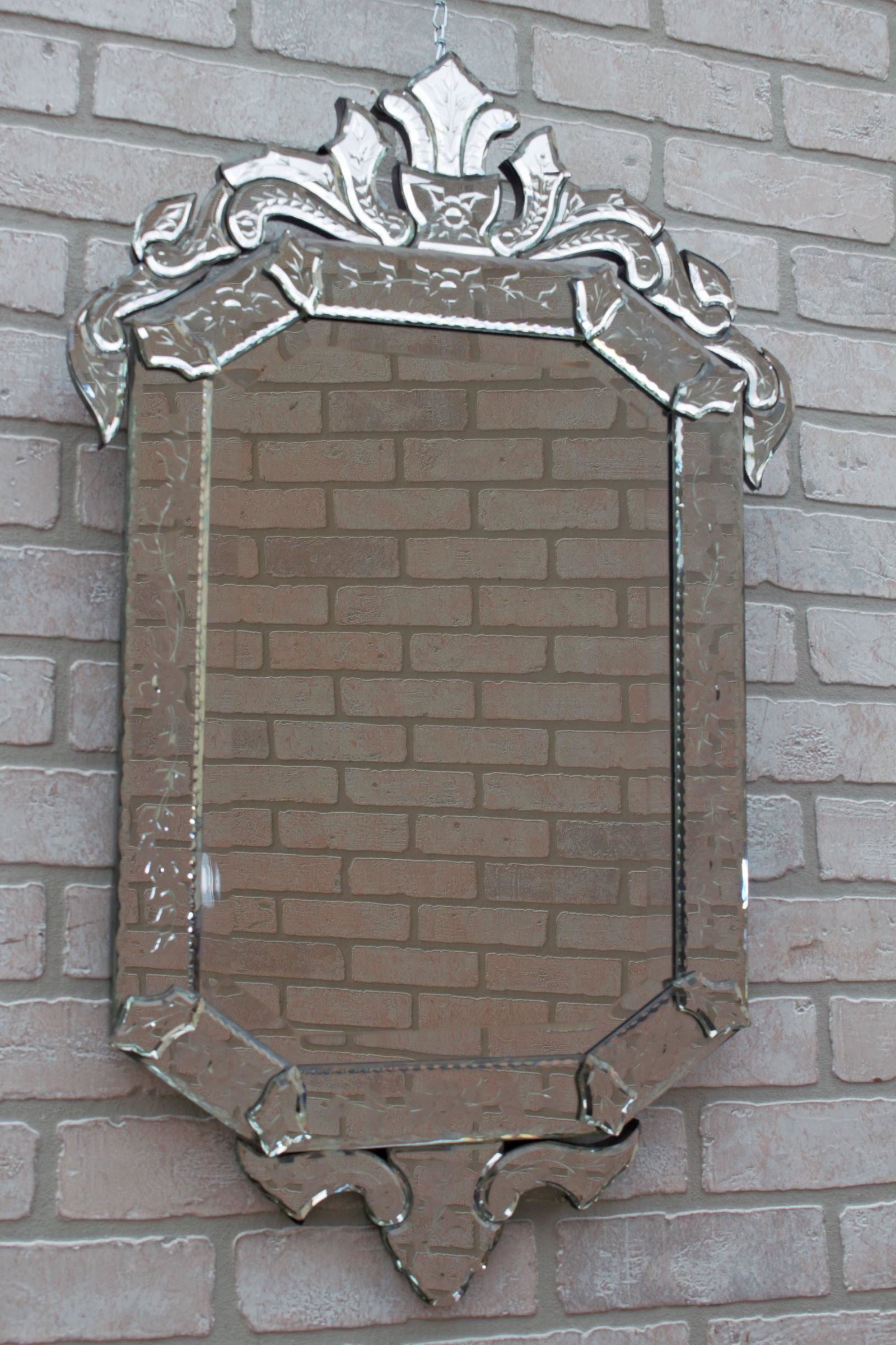 Hollywood Regency Venetian Etched and Beveled Glass: Hollywood Regency Venetian Etched and Beveled Glass Wall Mirror - Pair A Venetian wall mirror in the Hollywood Regency manner with an elaborately detailed frame decorated with frosted and convex flora