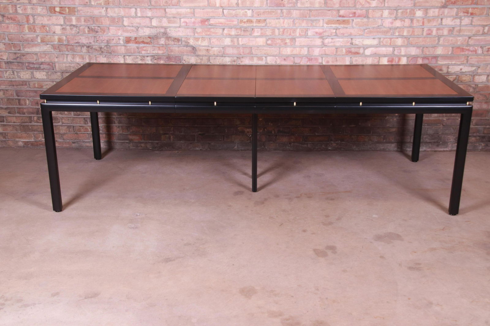 Michael Taylor for Baker Furniture New World Collection: An exceptional mid-century modern Hollywood Regency Chinoiserie extension dining table By Michael Taylor for Baker Furniture "New World Collection" USA 1950s Cherry wood with black lacquered trim and