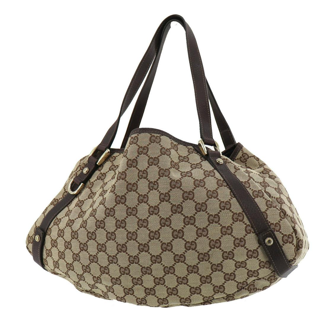 Authentic GUCCI Tote Bag: Brand: GUCCI Model: Tote Bag Country of Origin: Italy Material: Canvas Color: Gold Bag Length: 15.7 Bag Height: 9.8 Bag Depth: 4.3 All Bidhaus items come with a 100 % money-back authenticity guarantee