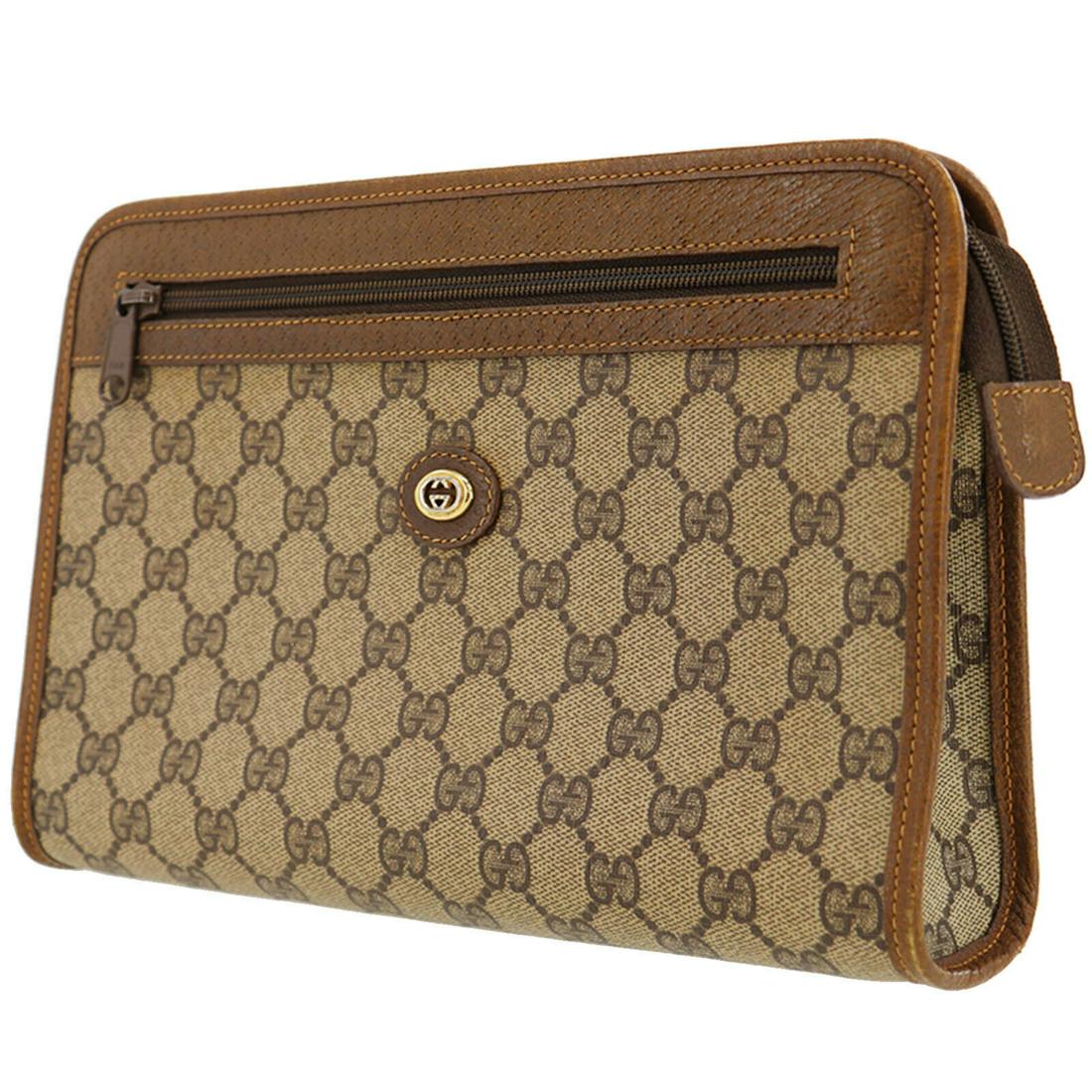 Authentic GUCCI Pouch: Brand: GUCCI Model: Pouch Country of Origin: Italy Material: Leather Color: Gold Bag Length: 10.4 Bag Height: 7.0 Bag Depth: 2.3 All Bidhaus items come with a 100 % money-back authenticity guarantee. 