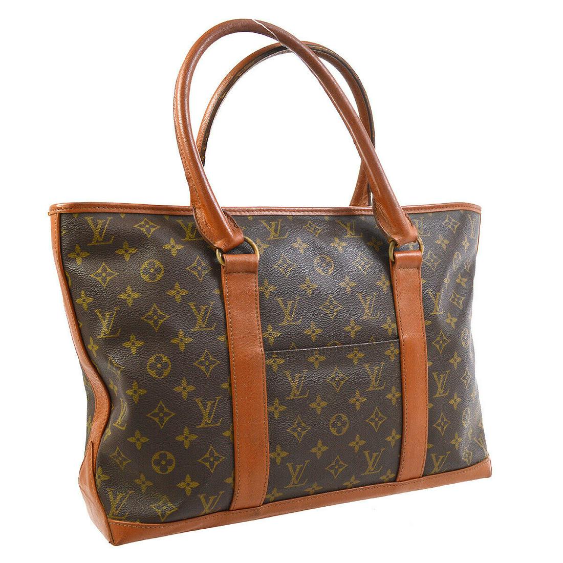 Authentic LOUIS VUITTON Monogram Double Handles: Brand: LOUIS VUITTON Model: Monogram Double Handles Country of Origin: France Material: Leather Color: Brown Size (Inch): W 15.7 x H 11.4 x D 3.5 " Strap Drop. 6.7 " Size (CM): W 40.0 x H 29.0 x D 9.0