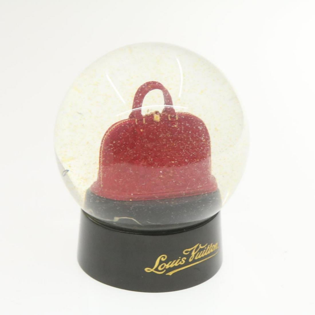Authentic LOUIS VUITTON ALMA - Snow Dome: Brand: LOUIS VUITTON Material: - Style: Snow Dome Color: - Size(inch): W3.54 x H4.7" (Approx) Country of Origin: - Accessory: There is no item box and dust bag. We will send only the item which is put