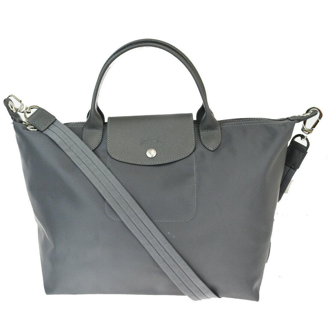 Authentic LONGCHAMP Shoulder Bag: Brand: LONGCHAMP Model: Shoulder Bag Country of Origin: Material: Nylon Color: Gray Size (Inch): W11.8X H10.6X D6.7"Size (CM): W30X H27X D17Cm All Bidhaus items come with a 100 % money-back authentici