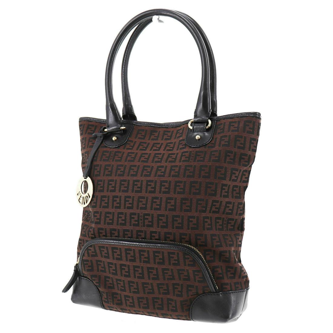 Authentic FENDI Tote Bag: Brand: FENDI Model: Tote Bag Country of Origin: Italy Material: Canvas Color: Silver Bag Length: 11.4 Bag Height: 11.0 Bag Depth: 3.1 All Bidhaus items come with a 100 % money-back authenticity guaran