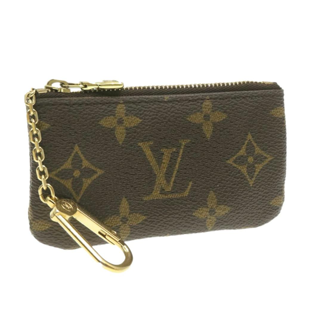 Authentic LOUIS VUITTON Monogram Canvas Coin Purse: Brand: LOUIS VUITTON Material: Monogram Canvas Style: Coin Purse Color: Monogram Size(inch): W4.7 x H2.8 x D0.4" (Approx) Country of Origin: Spain Accessory: Dust Bag / Item Box