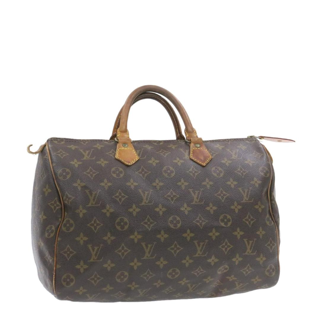 Authentic LOUIS VUITTON SPEEDY 35 Monogram Canvas Hand: Brand: LOUIS VUITTON Material: Monogram Canvas Style: Hand Bag Color: Monogram Size(inch): W14 x H9 x D7.5"(Approx) Country of Origin: France Accessory: There is no item box and dust bag. We will send