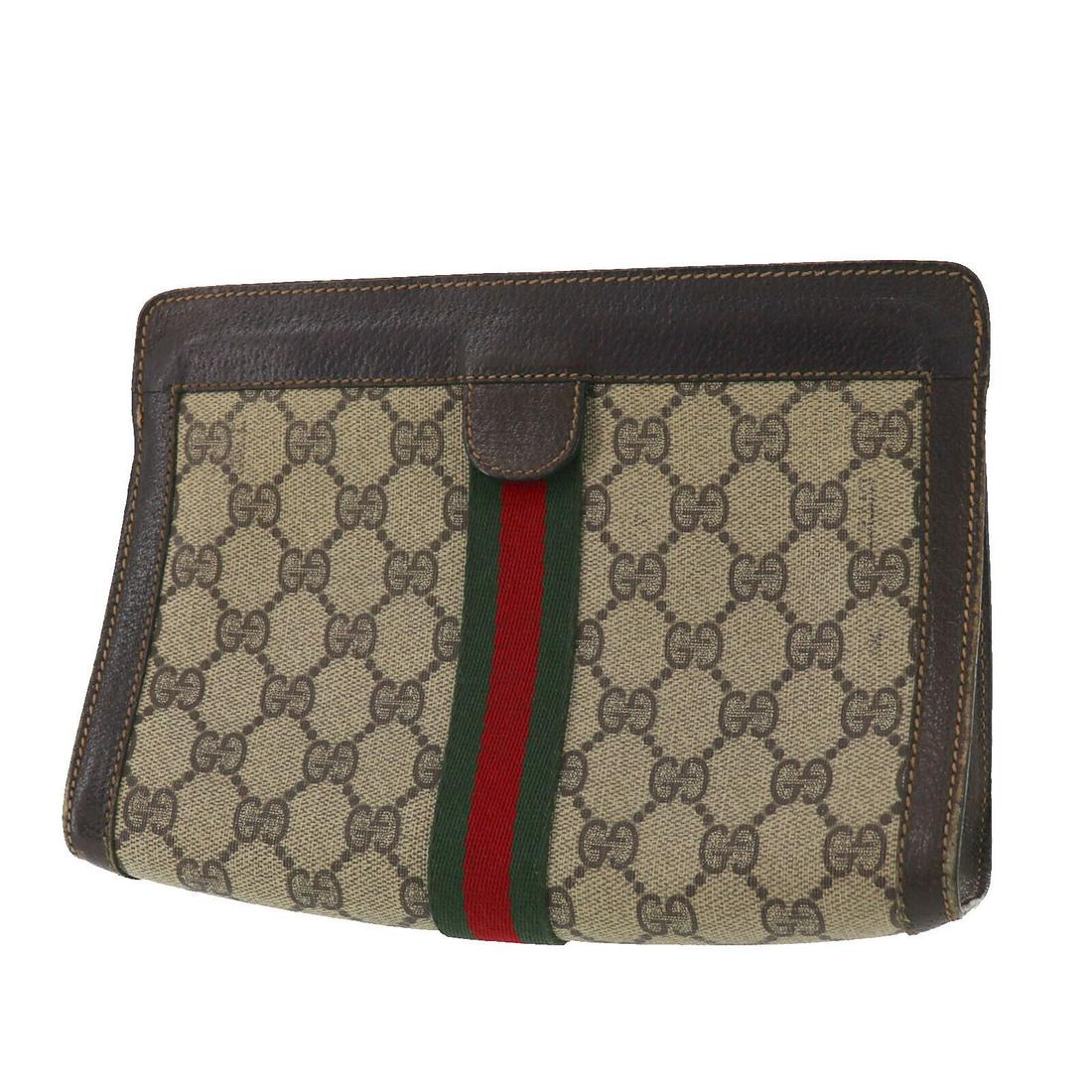 Authentic GUCCI Clutch: Brand: GUCCI Model: Clutch Country of Origin: Italy Material: Leather Color: Beige Bag Length: 8.8 Bag Height: 6.2 Bag Depth: 2.5 All Bidhaus items come with a 100 % money-back authenticity guarantee.