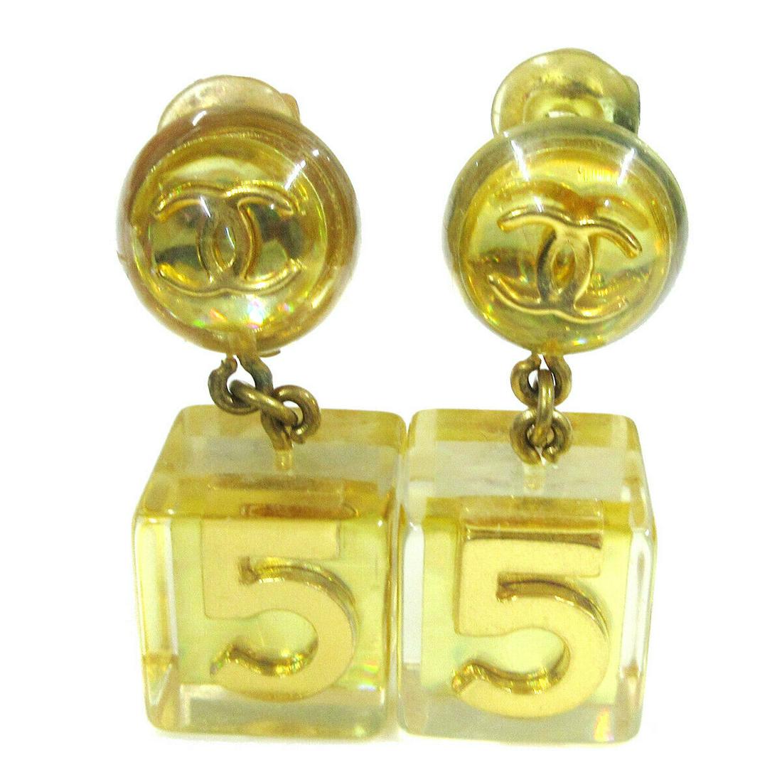 Authentic CHANEL Earrings: Brand: CHANEL Model: Earrings Country of Origin: France Material: Plastic Color: Clear Gold Size (Inch): W 0.6 " x H 1.5 " Size (CM): W 1.6 x H 3.8 cm All Bidhaus items come with a 100 % money-back au