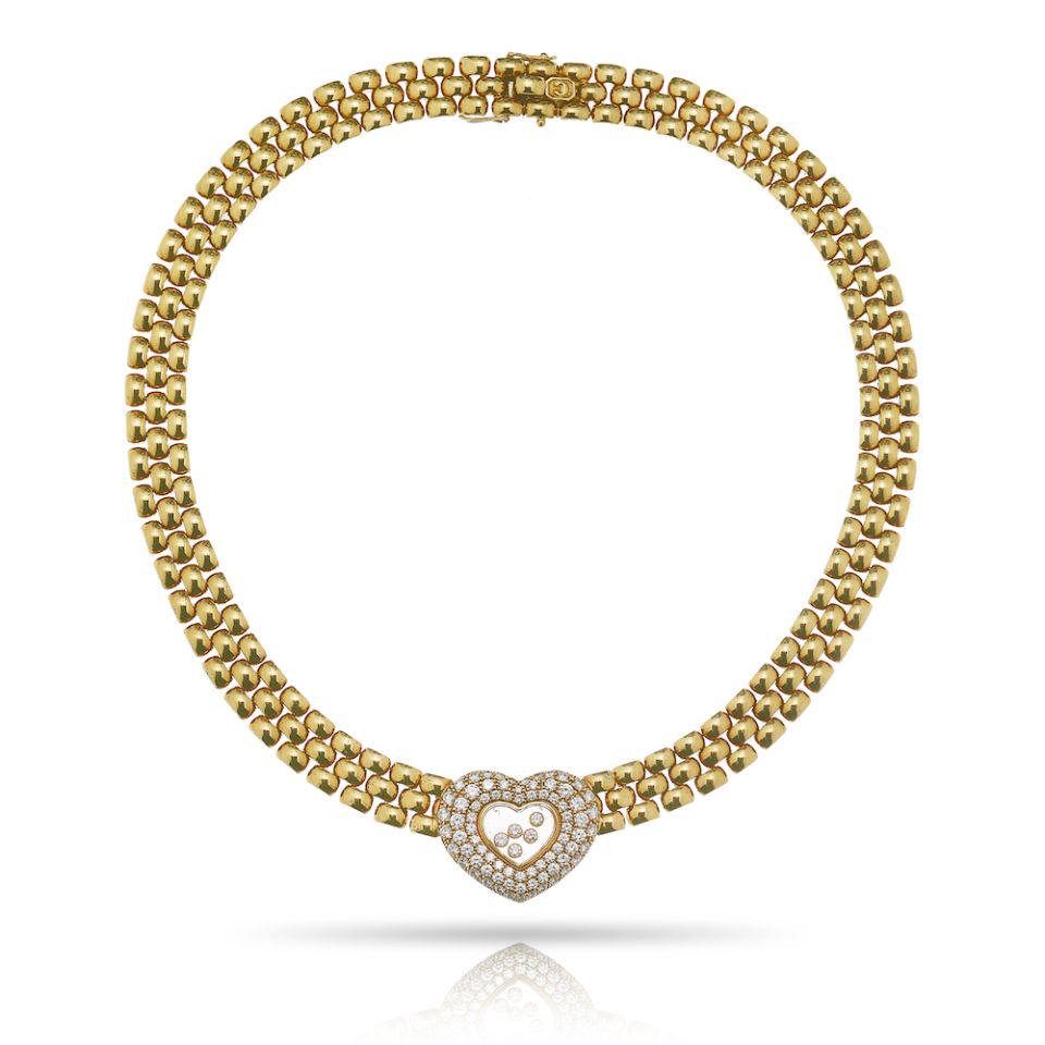 Authentic Chopard Chopard 18K Yellow Gold Happy: Type: Vintage Necklaces Brand: Chopard Metal: 18K Yellow Gold Grams: 120.8 Approximate Diamond Weight: 2.75 Cts Other Details: CHOPARD 18K YELLOW GOLD HAPPY DIAMOND HEART YELLOW GOLD NECKLACE.Metal: 1