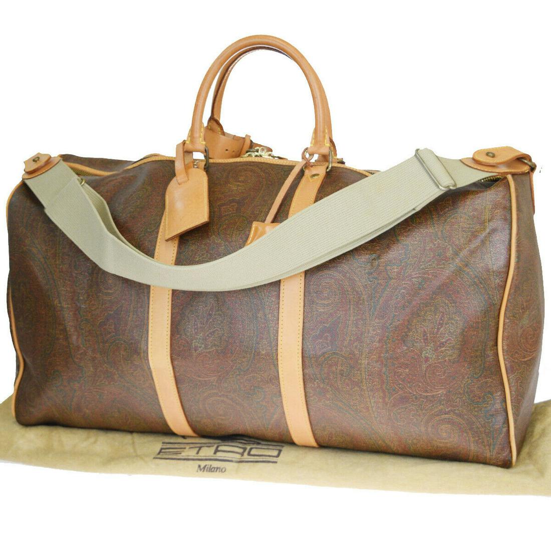 Authentic ETRO Shoulder Hand Bag: Brand: ETRO Model: Shoulder Hand Bag Country of Origin: Italy Material: PVC Leather Color: Bordeaux Size (Inch): W23.6X H13X D10.6"Size (CM): W60X H33X D27Cm All Bidhaus items come with a 100 % money-