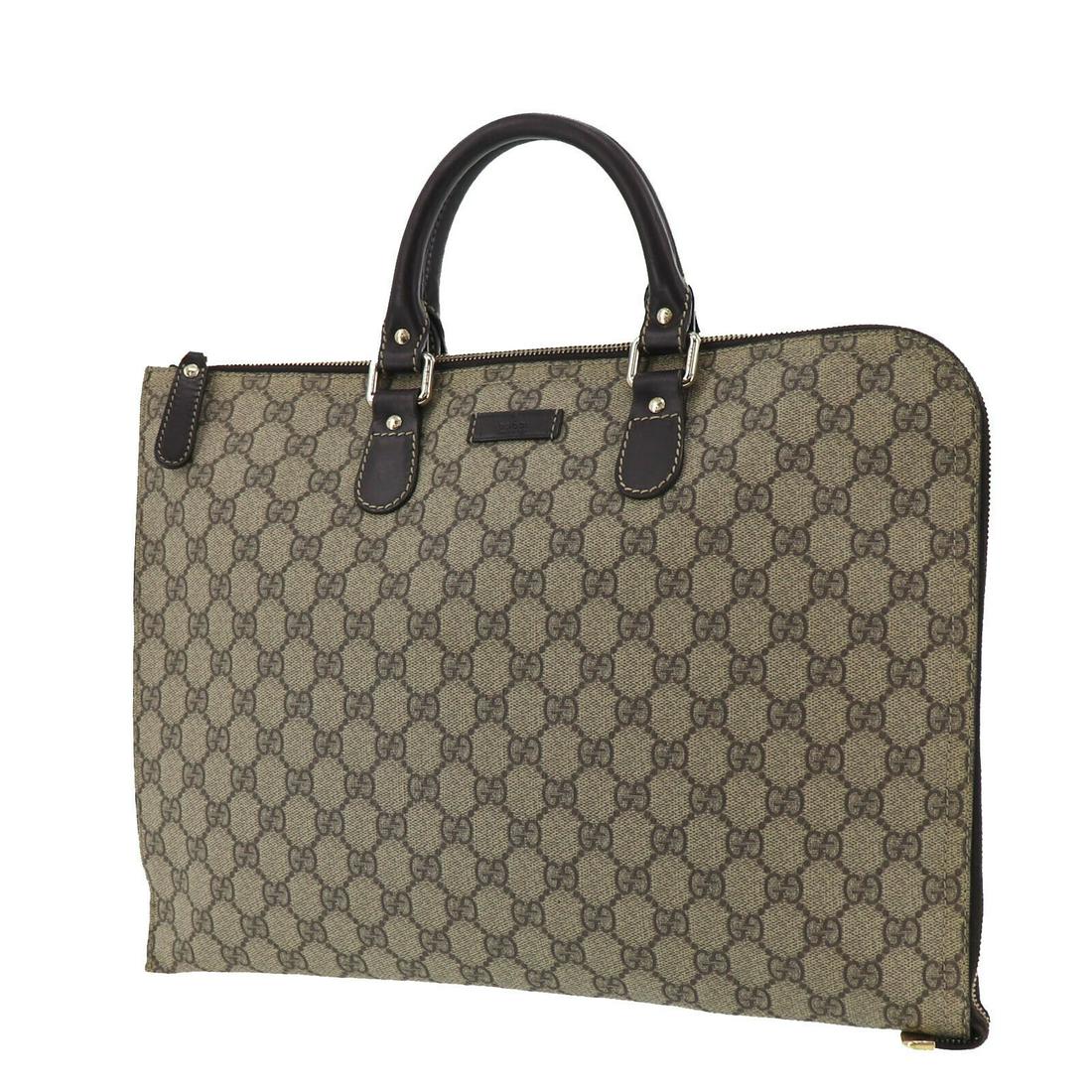 Authentic GUCCI Brief Case Bag: Brand: GUCCI Model: Brief Case Bag Country of Origin: Italy Material: Canvas Color: Gold Bag Length: 14.9 Bag Height: 10.8 Bag Depth: 0.7 All Bidhaus items come with a 100 % money-back authenticity gu