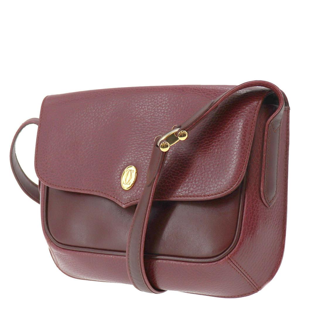 Authentic CARTIER Shoulder Bag: Brand: CARTIER Model: Shoulder Bag Country of Origin: Material: Nylon Color: Bordeaux Size (inch): medium All Bidhaus items come with a 100 % money-back authenticity guarantee. ALL SALES ARE FINAL. Pl