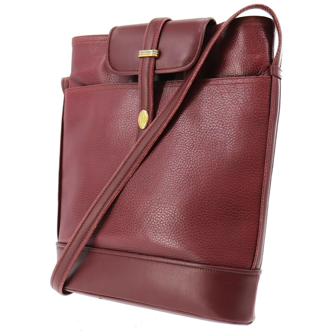Authentic CARTIER Shoulder Bag: Brand: CARTIER Model: Shoulder Bag Country of Origin: Material: Nylon Color: Bordeaux Size (inch): medium All Bidhaus items come with a 100 % money-back authenticity guarantee. ALL SALES ARE FINAL. Pl