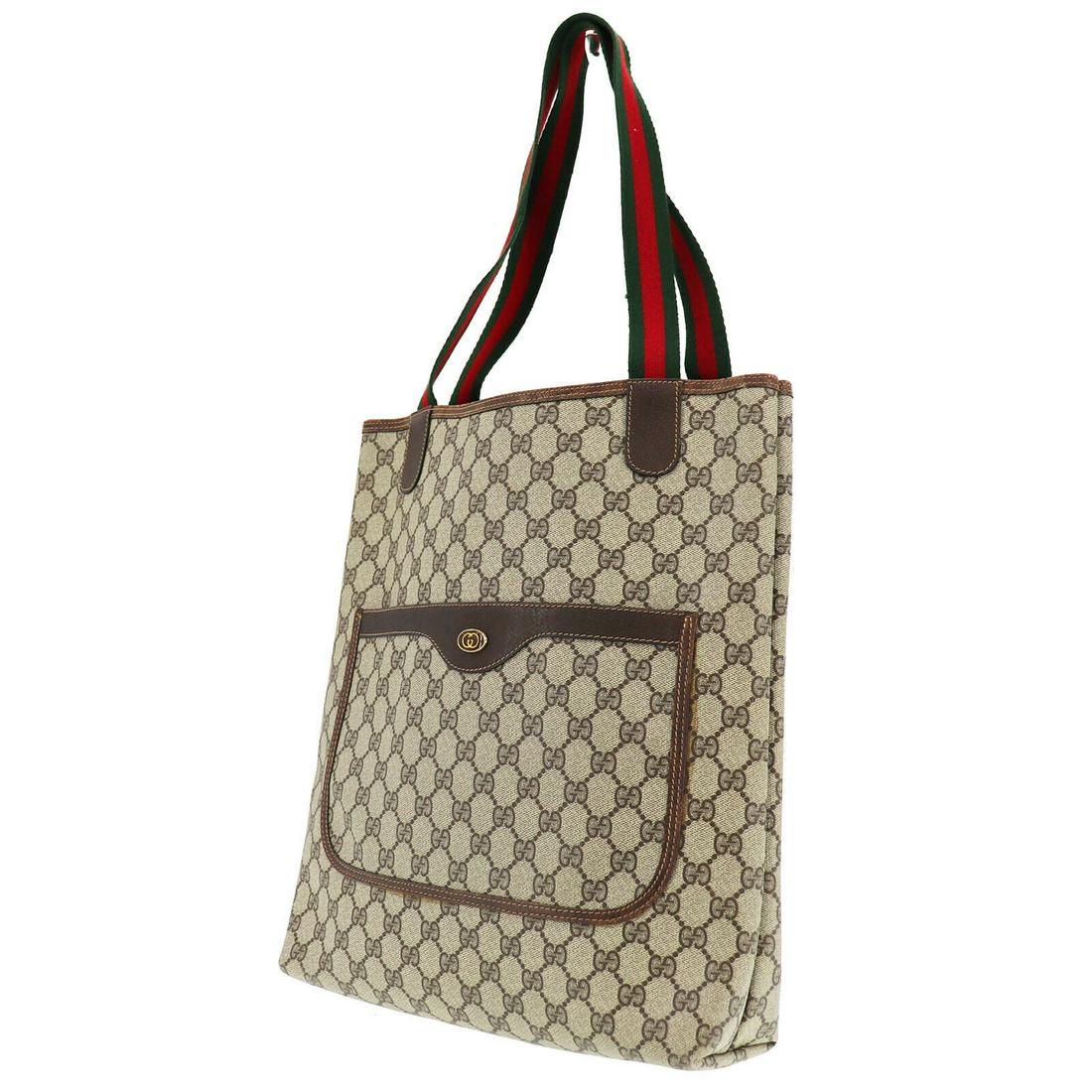 Authentic GUCCI Tote: Brand: GUCCI Model: Tote Country of Origin: Italy Material: Canvas Color: Gold Bag Length: 12.2 Bag Height: 14.5 Bag Depth: 3.5 All Bidhaus items come with a 100 % money-back authenticity guarantee. A