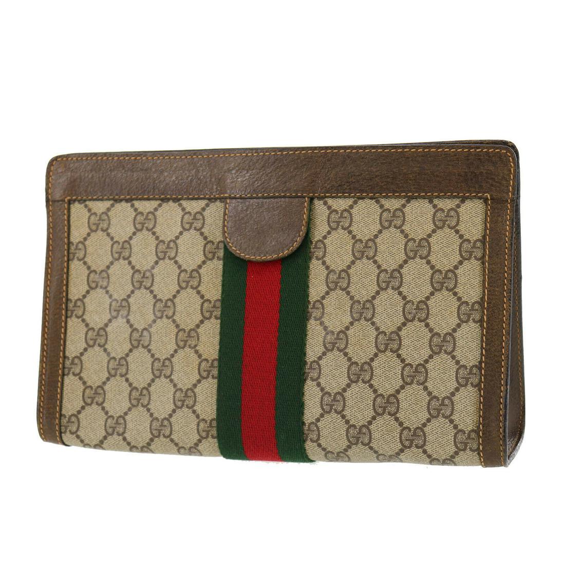 Authentic GUCCI Clutch: Brand: GUCCI Model: Clutch Country of Origin: Italy Material: Leather Color: Beige Bag Length: 10.8 Bag Height: 6.8 Bag Depth: 3.1 All Bidhaus items come with a 100 % money-back authenticity guarantee